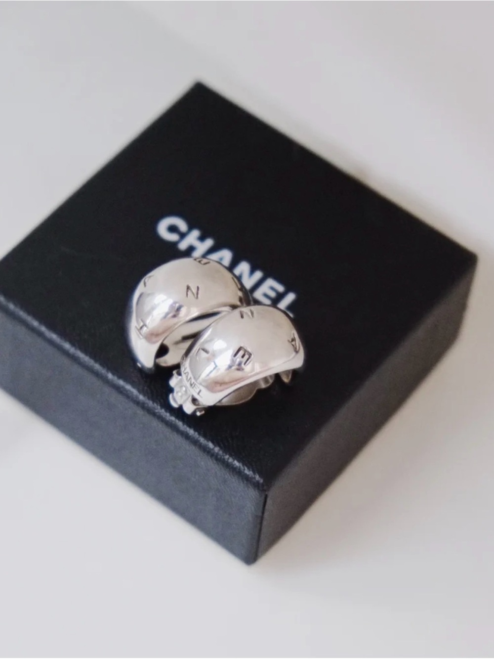CHANEL Sterling Silver Logo Clip Hoop Earrings